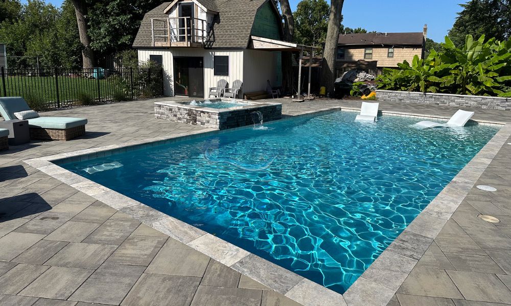 gunite pool with water lounge chairs in High Bridge PA