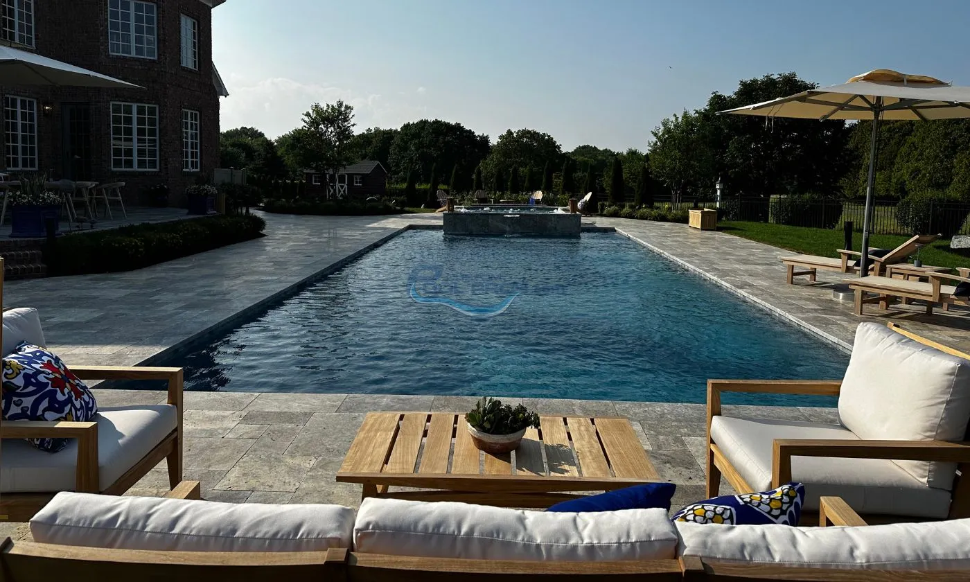 inground pool with dark water color plaster finish backyard, with umbrella, lounge outdoor sitting area, swimming pool contractor, inground pool